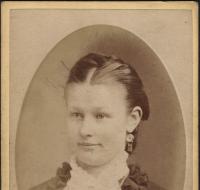Young woman with ornate collar