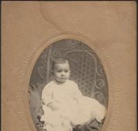 Young child in white dress