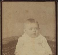 Infant in christening gown