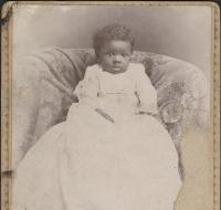Baby in a Christening gown (front and back of photograph)