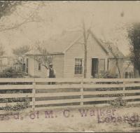 Home of M.C. Walker, Lebanon, Mo. with note and address on the back of M.C. Walker home postcard